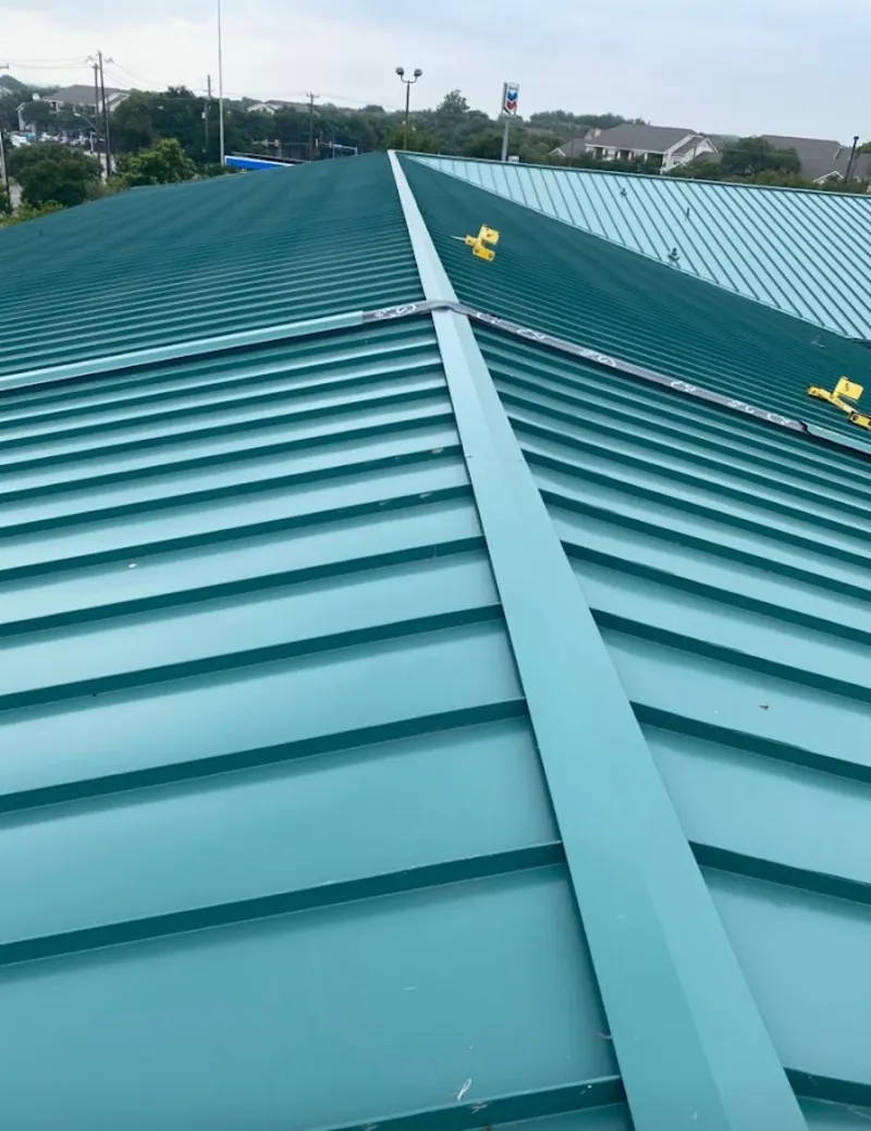 Green commercial metal roof ridge and valley for Metal Roof Repair in Bonner Springs