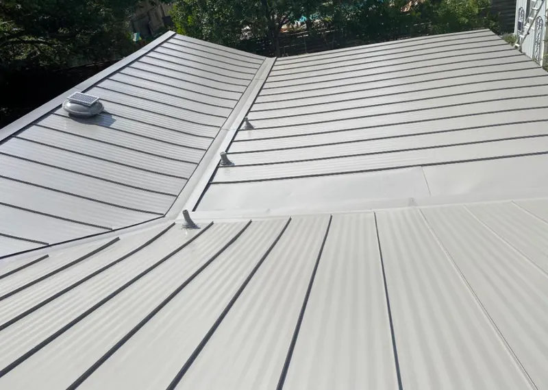 Solar attic fan installed on a metal roof for Roof Ventilation in Bonner Springs